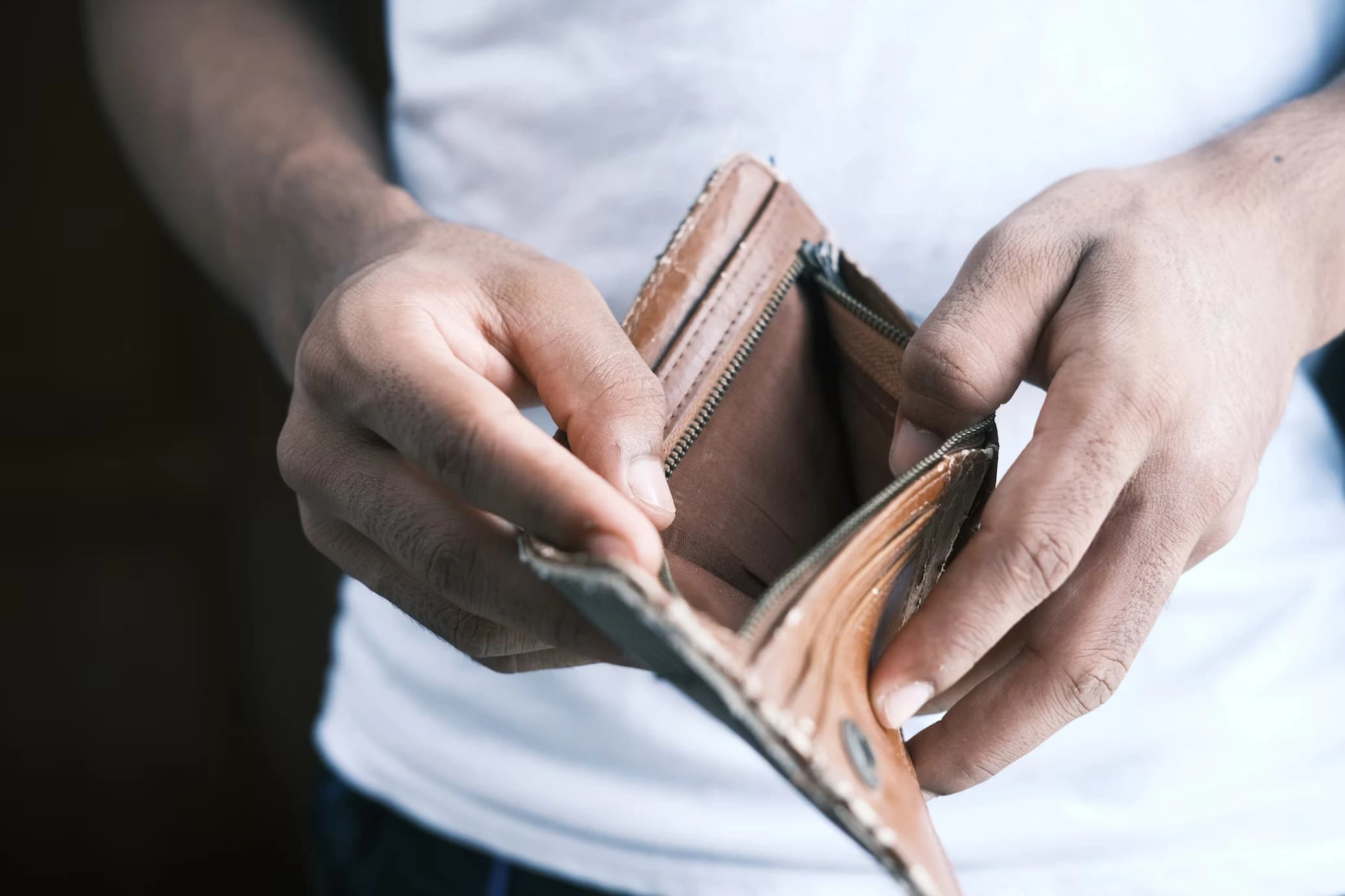 Man with empty wallet